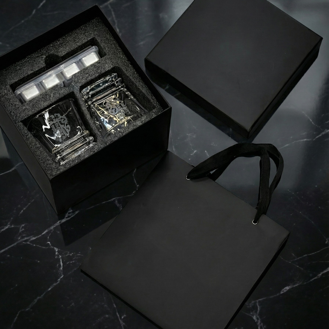 Luxury Midnight Manor whiskey gift set with two 300ml gothic glasses and laser-etched stainless steel cooling cubes on a black marble surface