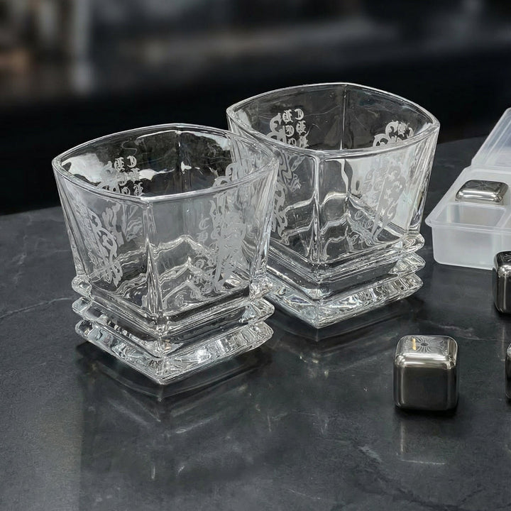 Luxury Midnight Manor whiskey gift set with two 300ml gothic glasses and laser-etched stainless steel cooling cubes on a black marble surface