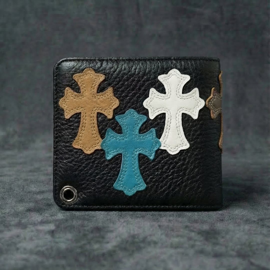 Close-up of a reinforced metal eyelet for a wallet chain on a black gothic cross leather billfold